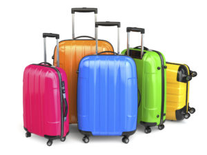 Luggage. Colorful suitcases on white isolated background. 3d